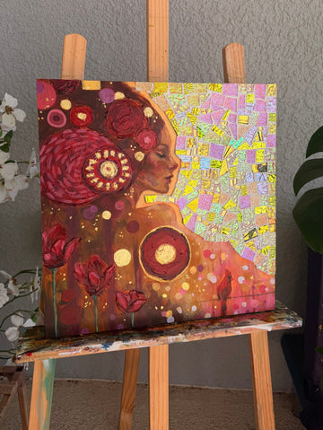 Abstract painting on a wooden easel against a gray wall