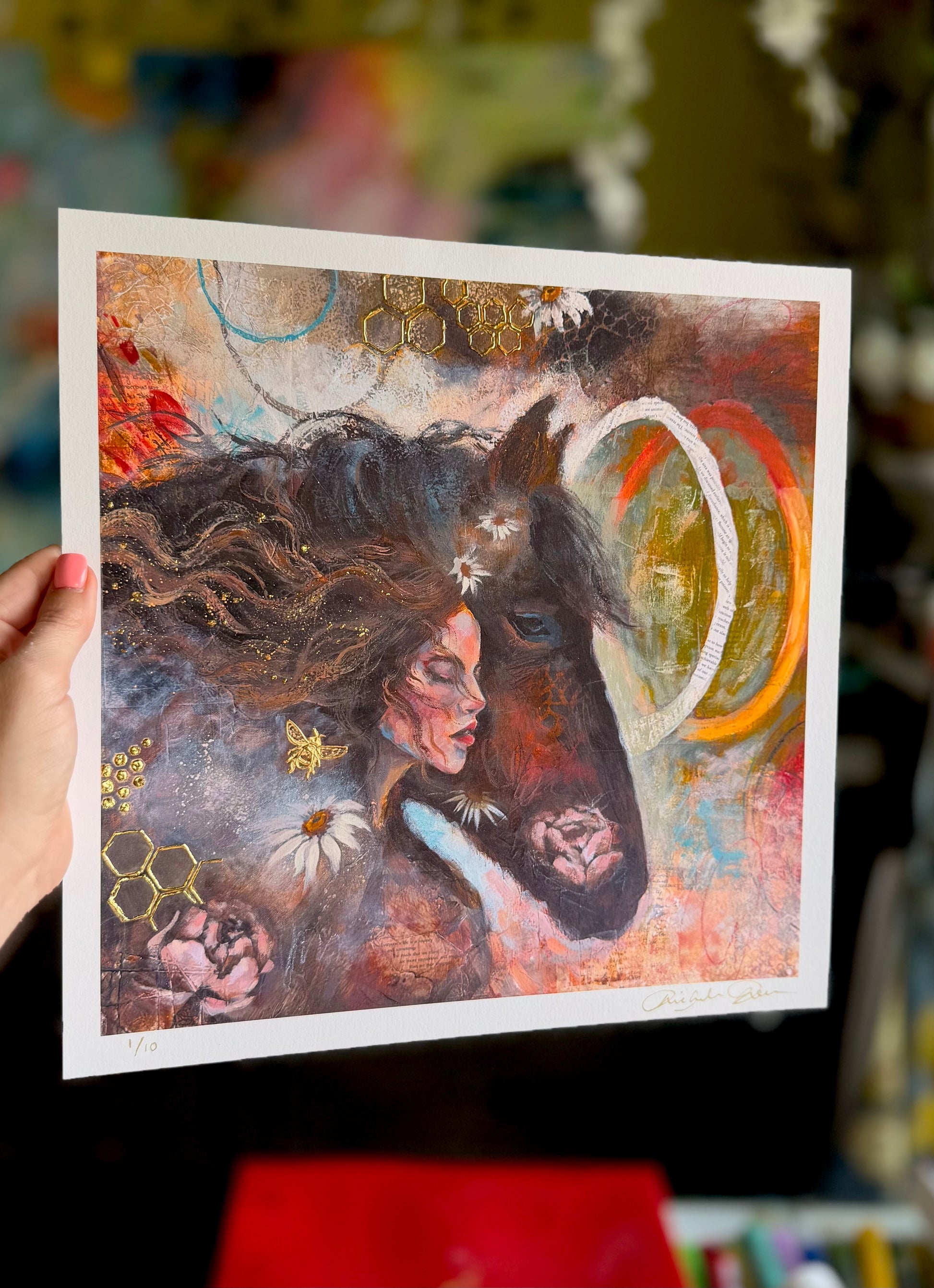 Artistic depiction of a woman with flowing hair and abstract elements, held by a hand.